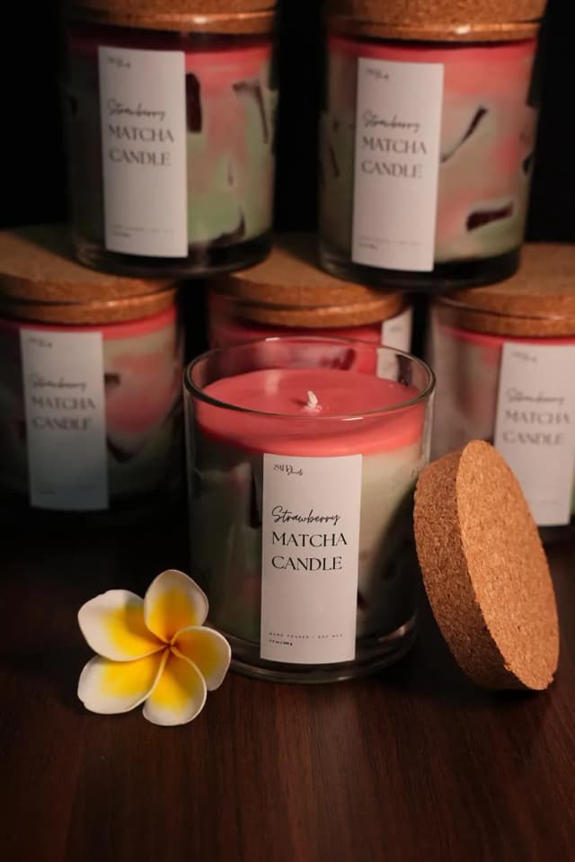 Set of three scented candles in glass jars